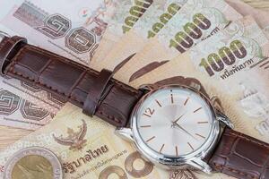 Watch and banknote photo
