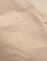 Brown Textured Crumpled Craft Paper Background photo