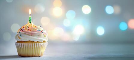Colorful birthday cupcake with candles on a light background, winner of a stock photo contest, in a minimalistic style, studio shot, with pastel colors, high-resolution photography, bokeh effect, blur