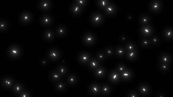Glowing White Particles Moving in Random Directions. Sparkles Glow. 4K video