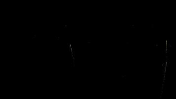 Fireworks pop up on a dark background. Colorful fireworks video