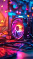 An illuminated CPU cooler glimmers amidst a colorful electronic workspace at night photo