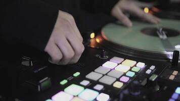 Click colored squares on mixer panel. ART. Hands in dark room are dialing code from multi-colored squares. Abstract music on mixer color board photo