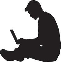 silhouette of a man sitting on the floor with a laptop vector