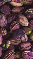 Rotating background of lots of pistachios, Close up, Slow motion video