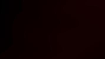 abstract clowing background with red blurred gradients moving on dark video