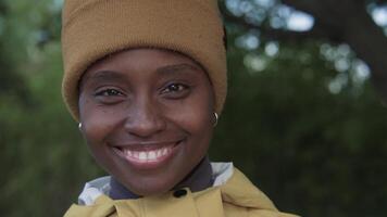 A portrait of an African American woman smiling looking confident and joyful at camera. video