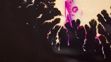 A crowd gathered around the violet stage at the art event video