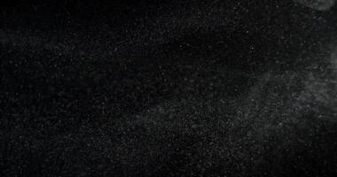Real dust particles on black screen overlay. Filmed with RED camera in slow motion. Abstract shapes background. video