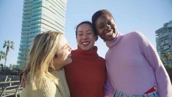Friends are sharing a happy moment, smiling for a picture in a park enjoying the fun together. video