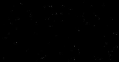Dust particles floating on black background in slow motion overlay. Atmosphere filmed with RED camera video