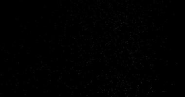 Particles floating on black background in slow motion overlay. Atmosphere filmed with RED camera video