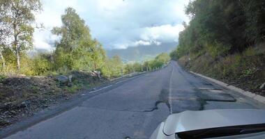 Drive on the access road to Gergeti Trinity Church in the Caucasus, with scenic Georgian landscape video