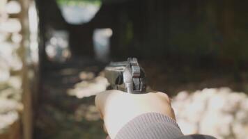first person view Russian Makarov pistol shooting pneumatic training of Russian soldiers concept in the forest in summer or in an abandoned building video