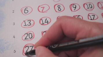 red marker circles the dates in the calendar background video