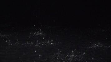 Super Slow Motion of rain drops at 1000 fps on black background. Waterfall at 1000 frames per second. Weather concept super slow motion shot on high speed camera 1000 fps. video