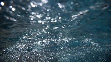 Underwater view of professional swimmer training in swimming pool, 4k 120 fps super slow motion raw . Triathlete swim in black wetsuit video