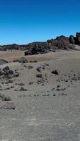 Road winding through mountainous terrain of Tenerife, showing the dramatic volcanic slopes and clear blue skies. video