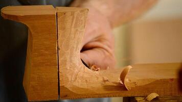 Luthier with chisel working in wood video