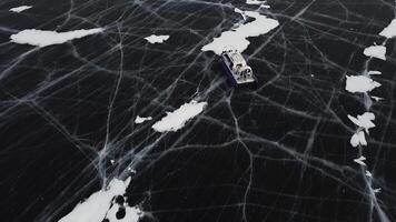 Snow air motion boat goes on big snow field of a frozen lake. Clip. Aerial view of icy surface of the Baikal lake near cliffs of Olkhon Island. photo