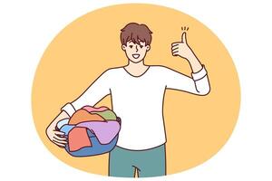 Man householder with laundry in basin shows thumbs up recommending quality laundry detergent vector