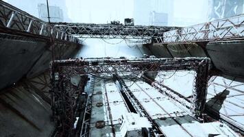 Ruined oil terminal with rust and debris in a winter scene video
