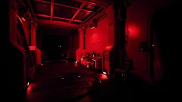 Exploring the dimly lit interior of a space station with red lighting video