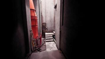 Exploring a dark concrete corridor within an industrial building at dusk video