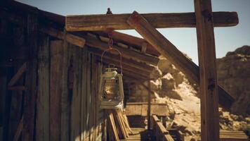 Lantern hanging in a rustic wooden shed in a remote desert location video