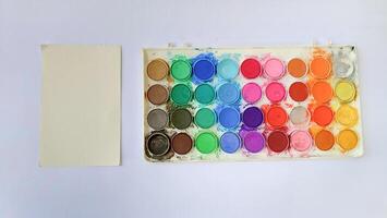 Set with strokes of colorful oil paints on white background, top view photo