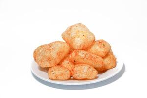 Kerupuk kulit,rambak, jangek, krecek, karodok, are a traditional Indonesian snack made from cow or sheep skin, with a spicy taste. photo