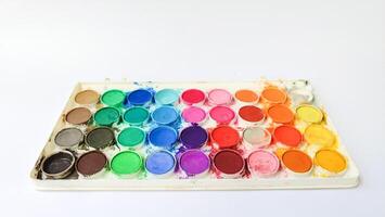 Set with strokes of colorful oil paints on white background, top view photo