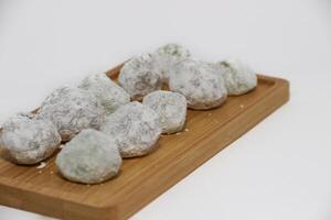 Mochi - trendy and sweet dessert, Mochi cake on a plate on a white background. photo