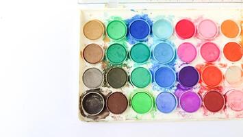 Set with strokes of colorful oil paints on white background, top view photo