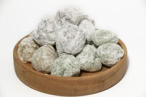 Mochi - trendy and sweet dessert, Mochi cake on a plate on a white background. photo