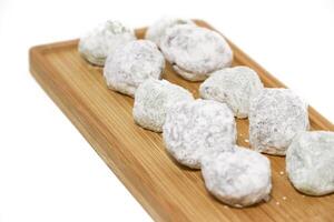 Mochi - trendy and sweet dessert, Mochi cake on a plate on a white background. photo