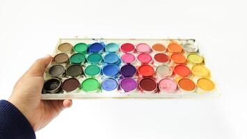 Set with strokes of colorful oil paints on white background, top view photo