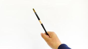 Different brushes with paints on white background photo