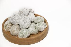 Mochi - trendy and sweet dessert, Mochi cake on a plate on a white background. photo