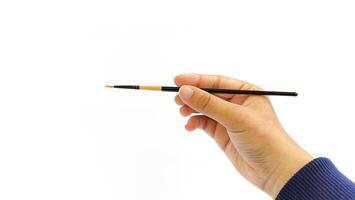 Different brushes with paints on white background photo