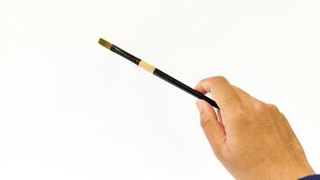 Different brushes with paints on white background photo
