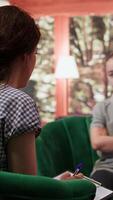 Rebellious teenager with an attitude discussing with therapist about her mental health issues, aggressive intrusive thoughts. Girl with murder behavior and anger management issues. Camera B. video