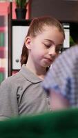 Troubled teen shares ominous drawings with a psychoanalyst during counseling. Sketches display violent thoughts and aggression, signaling dangerous behavior and mental health concerns. Camera A. video
