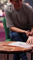 Teen girl participates in a drawing activity as part of psychotherapy, helping her express feelings and intrusive thoughts. Session to overcome personal struggles through art. Camera A. video