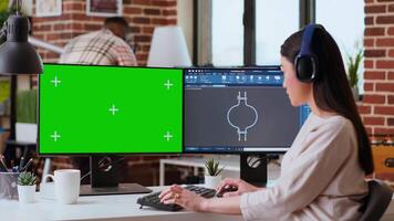 Industrial engineer works with CAD software and isolated mockup in a modern workspace at home. The setup includes dual monitors, highlighting the technical side of industrial design. Camera B. video
