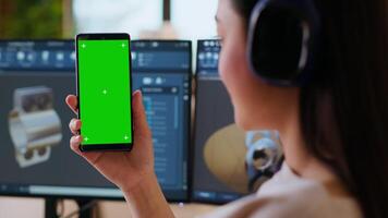 Industrial engineer works with CAD software and isolated mockup in a modern workspace at home. The setup includes dual monitors, highlighting the technical side of industrial design. Camera B. video
