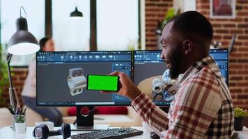 Male freelance designer works remotely on 3D prototypes using green screen and CAD software. Home workspace highlights the balance between productivity and comfort in industrial design. Camera B. video