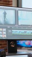 Vertical Empty editing tools and a color wheel running on pc at desk, timeline editing, color grading and media creation for a shoot. Post production software on dual monitors. video