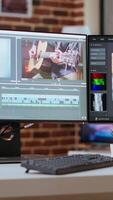 Vertical Media creation studio were specialists can work on editing footage for a cinematic project. Desk in living room includes advanced editing tools and tech equipment for post production. video