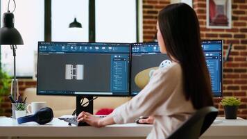 Expert engineer develops industrial prototypes using 3D modeling software at her home office, featuring dual monitors and modern office equipment perfect for innovative design processes. Camera B. video